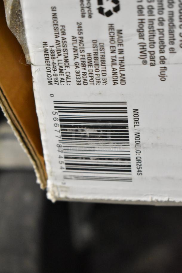 Close-up of a cardboard box showing model number QR254S. Manufactured in Thailand. Distributed by Home Depot. Bar code visible.