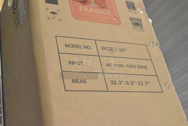 Cardboard box with model IKC01-30", input AC 110V-120V 60Hz, measures 32.3"-9.8"-22.7", marked fragile.