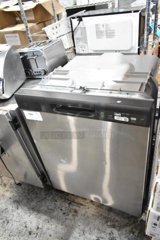 Stainless steel dishwasher with digital control panel, used. Auction lot tag: 194. Multiple cycle options visible.