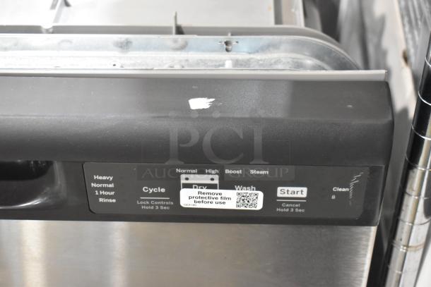 Dishwasher control panel showing cycle options: Heavy, Normal, Rinse, and buttons for Dry, Wash. Label: "Remove protective film before use." Condition shows minor wear.