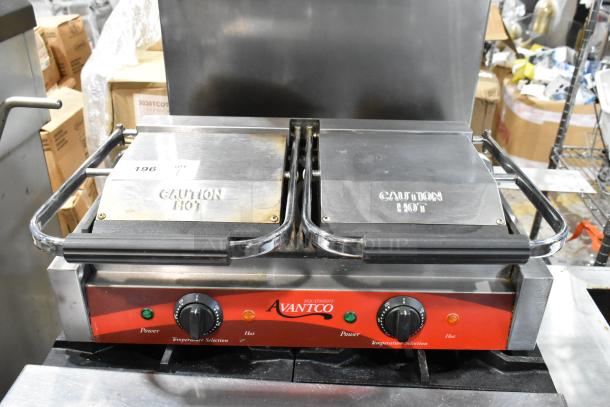 Avantco double panini grill, stainless steel, with "Caution Hot" labels, temperature controls, and power indicators.