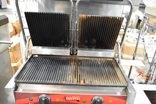 Avantco commercial panini press with ribbed plates, visible wear, adjustable temperature controls, ideal for sandwich grilling.