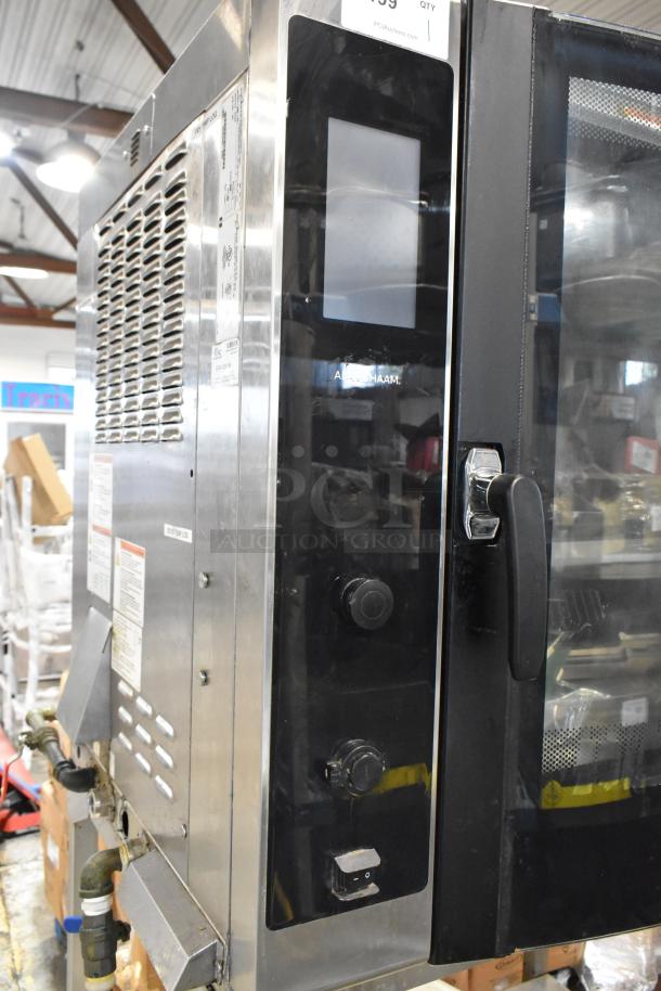 Alto-Shaam commercial oven, stainless steel, black control panel, visible dials, door handle, used condition, auction tag.