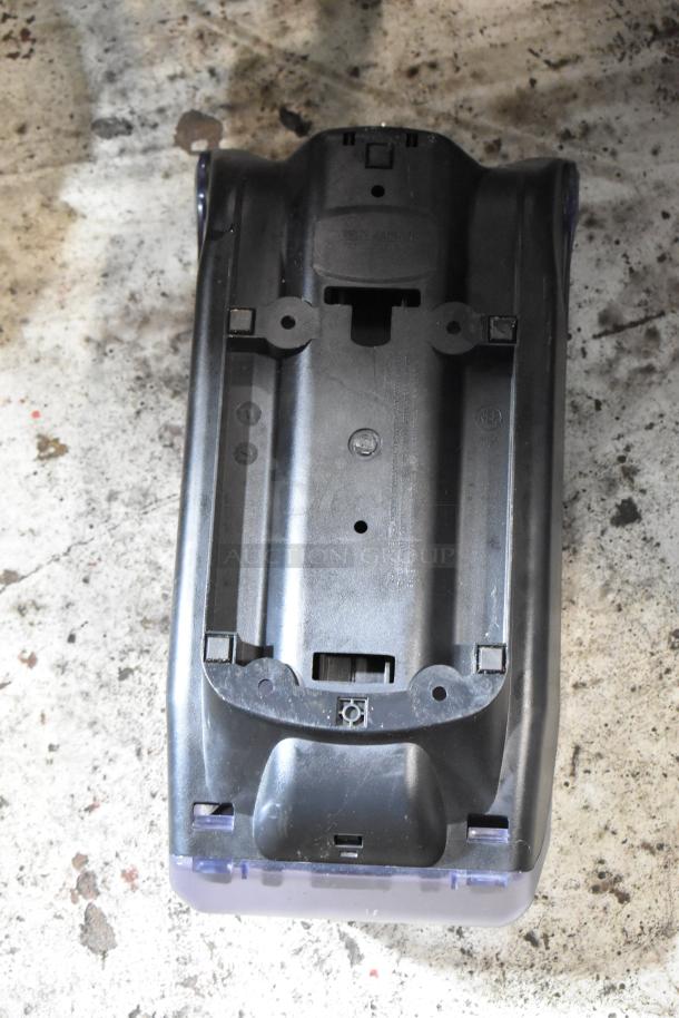 Black plastic vacuum cleaner base, slightly worn. Screw holes and connection slots visible; model details are embossed.