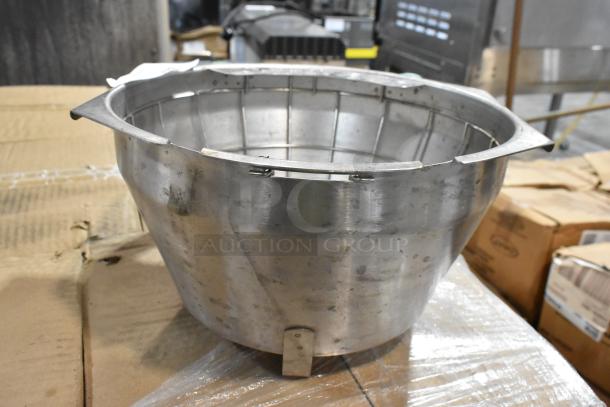 Large metal industrial mixing bowl, used condition, with noticeable wear and minor dents. Ideal for commercial use.