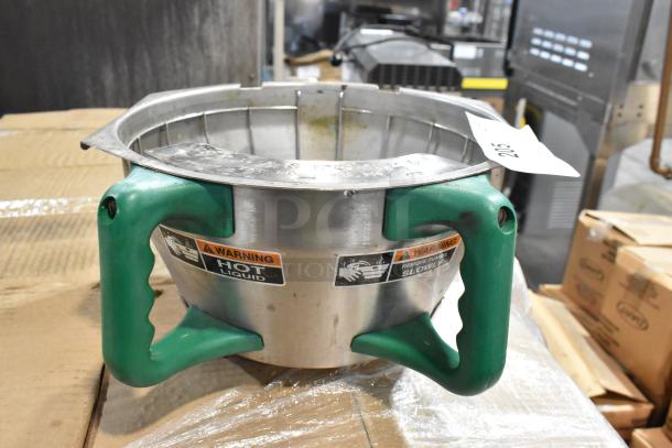 Stainless steel container with green handles, labeled with "Warning Hot Liquid" and "Remove Funnel Slowly." Used condition.