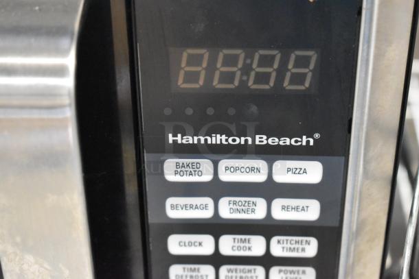 Hamilton Beach microwave control panel with preset buttons for baked potato, popcorn, and pizza. Digital display showing 00:00.