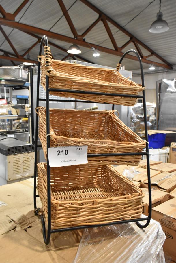 Three-tier wicker display rack with metal frame, item tag marked "210." Ideal for storage or retail use. Good condition.