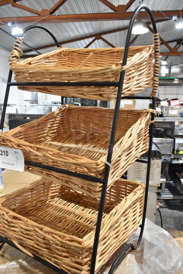Three-tier wicker basket shelf with metal frame, good condition. Auction tag with number 210 visible.