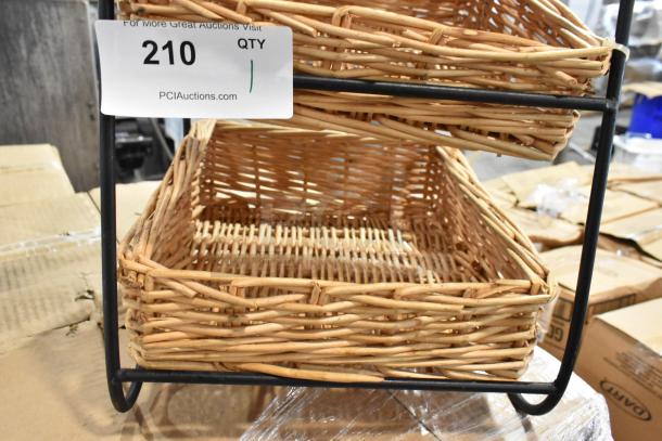 Tiered wicker basket display stand with metal frame, good condition. Auction lot number 210.