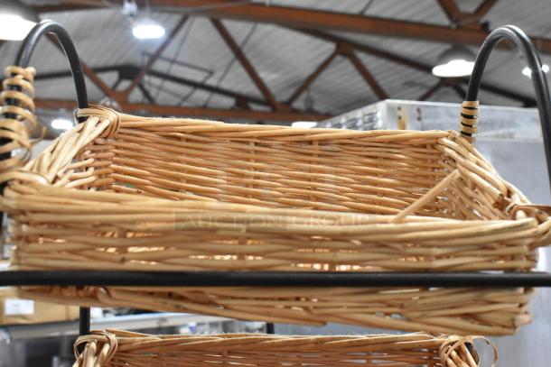 Wicker basket display rack, two-tier, black metal frame, natural woven texture, good condition, ideal for storage or display.