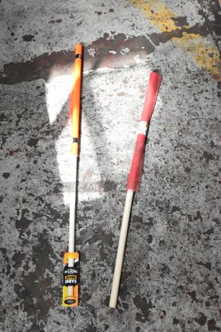 Two flag markers on ground; one orange, one red with "Cargo Maxx Traffic Flag" label. New condition.
