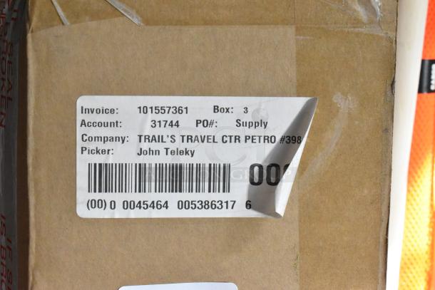 Shipping box with label showing invoice 101557361, account 31744, company Trail's Travel Ctr Petro #398, Picker John Teleky.