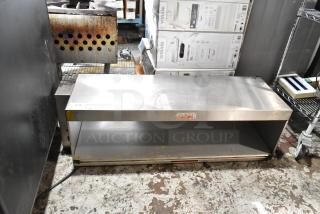 Stainless steel kitchen shelf with open storage, used condition, visible wear. Label reads "Caution: Hot." Tag number 213.