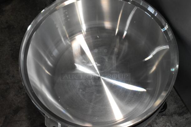Stainless steel pot, smooth finish, capacity markings inside, new condition, reflective surface, no visible blemishes.