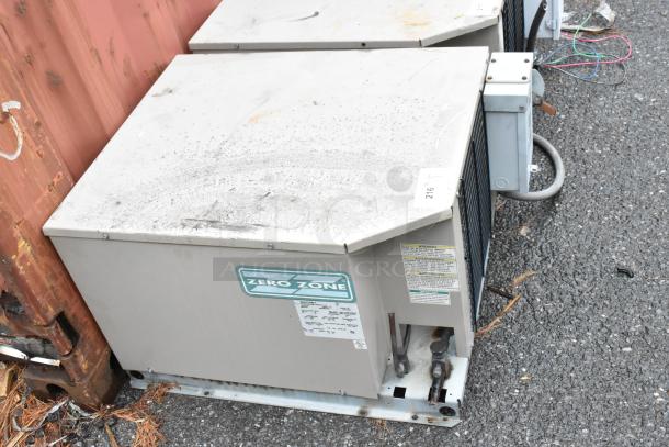 Zero Zone refrigeration unit, visible wear, model label with specifications, outdoor setting, used condition.