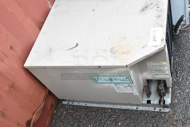 Zero Zone refrigeration unit, metal casing, visible wear, Model: 247711, warning labels, suitable for commercial use.