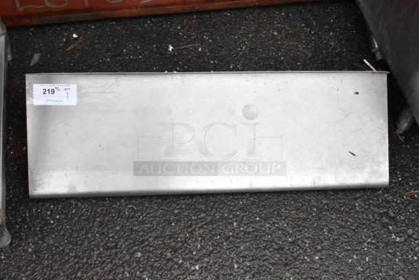 Metal panel with minor surface marks, auction tag "219" attached.