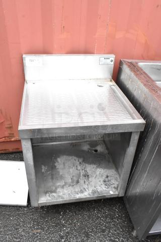 Stainless steel drip tray with backsplash, commercial grade, with visible signs of wear. Marking indicates "220V Qty 1."