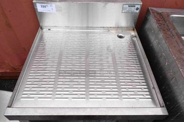 Stainless steel commercial drainboard with perforated surface, slight wear, Krowne label, NSF certified, auction tag visible.