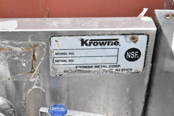Krowne metal unit with NSF label, visible wear and scratches, model and serial number sections blank, Krowne logo faucet handle.