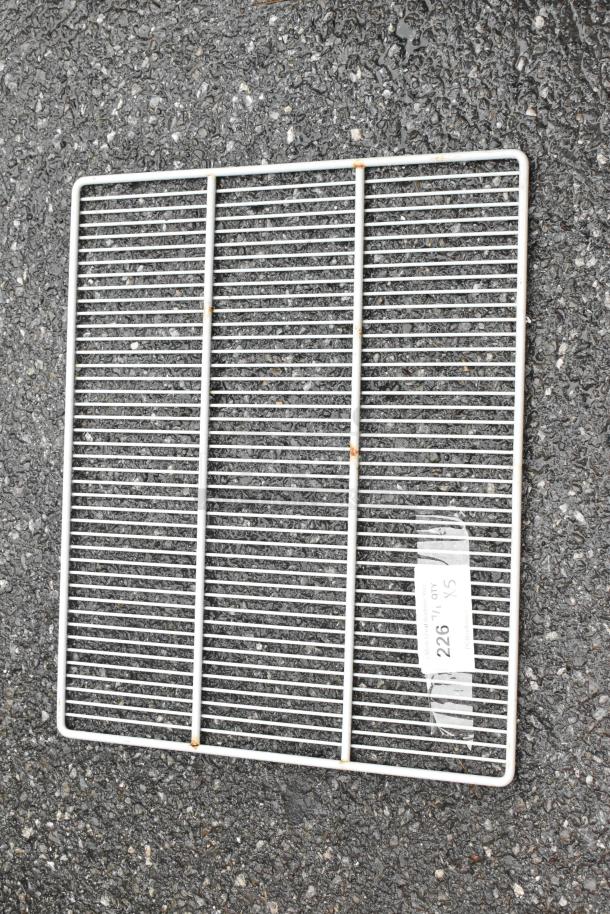 Metal grid shelf with slight rust, label "226 1/5 ADG SX" visible. Used condition, ideal for storage or DIY projects.