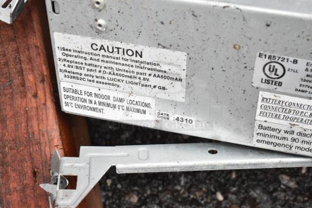 Metal electrical component with caution and usage labels, UL listed. Suitable for indoor damp locations, date code 4310.