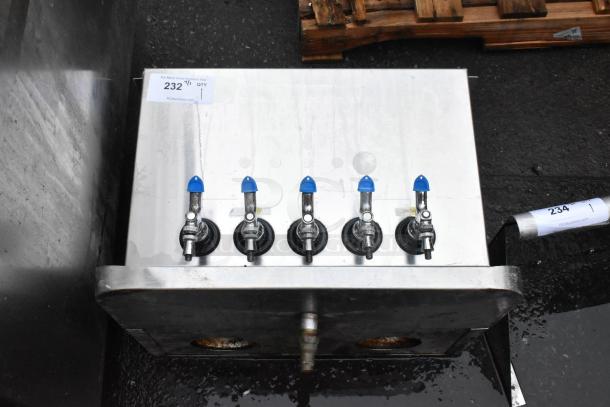 Stainless steel 5-tap beverage dispenser with blue handles, visible auction tag reads "232," on black surface, minor wear.
