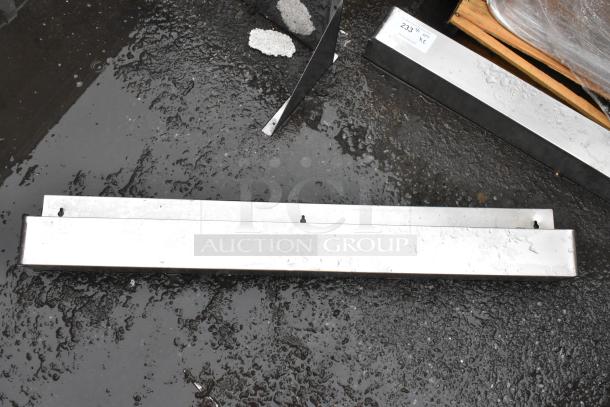 Metal beam, rectangular, slightly weathered, with bolt holes. It measures 233 5/8 inches. Suitable for construction.