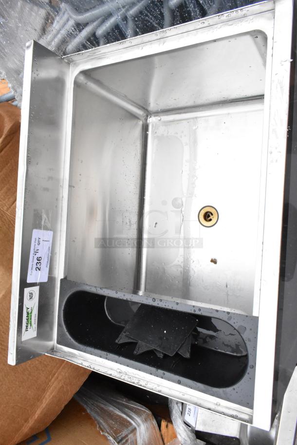 Stainless steel ice well with drainage, marked "Regency" and NSF certified. Includes drainage hole and plastic partition. New condition.