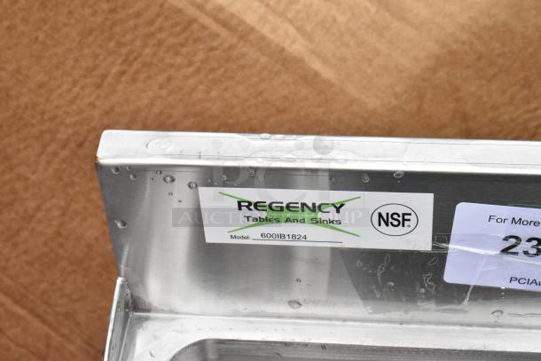 Regency stainless steel sink model 600IB1824, NSF certified, clear label, minor surface water droplets.