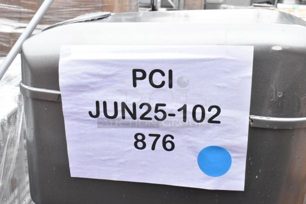 Metallic equipment with a label reading "PCI JUN25-102 876" and a blue dot. Condition appears used.