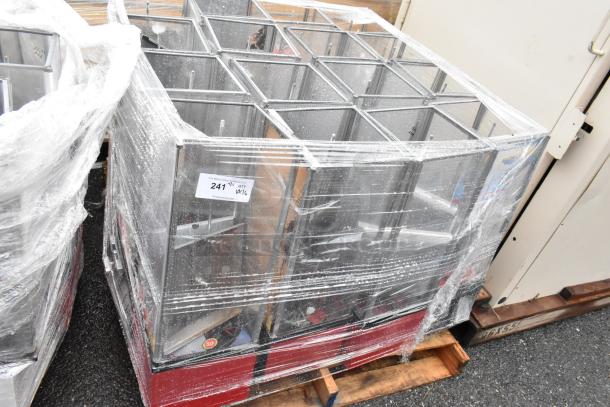 Pallet of glass display cases, wrapped in plastic. Label indicates lot 241, quantity of 16. Good condition.