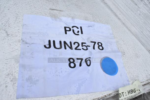 White paper tag with PCI, JUN25-78, 876, and a blue dot, indicating item identification or production date. Slightly worn condition.
