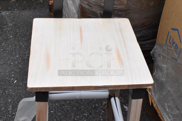 Wooden stool top with minimal wear, light finish, metal bracket supports. Suitable for indoor use. No visible tags.
