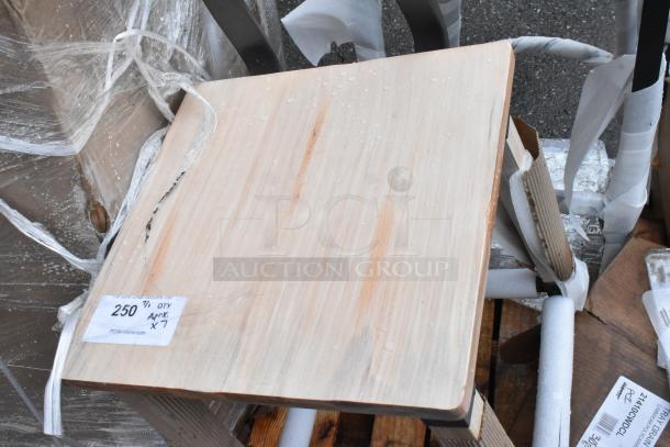 Wooden table top with water droplets, minor wear, includes label stating "250 7/1 QTY APX X 7", part of auction lot.