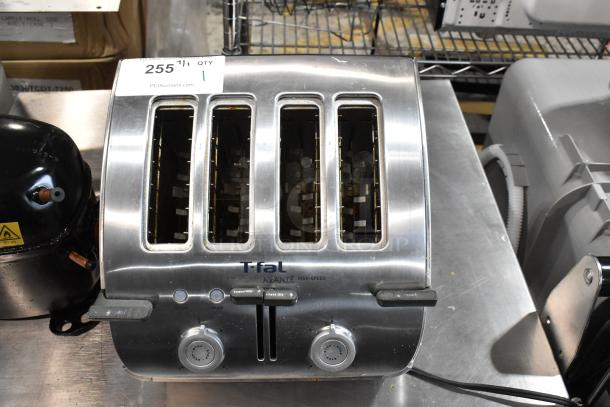T-fal Avante high-speed stainless steel 4-slice toaster with dial controls, visible wear, label reading "255 1 QTY 1."