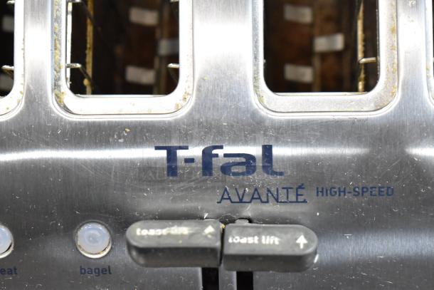 T-fal Avante high-speed toaster, stainless steel, with visible controls and slight wear, ideal for quick toasting.