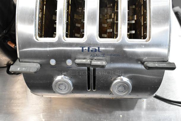 T-fal Avante high-speed toaster, four slots, stainless steel, used condition, features reheat and bagel settings.