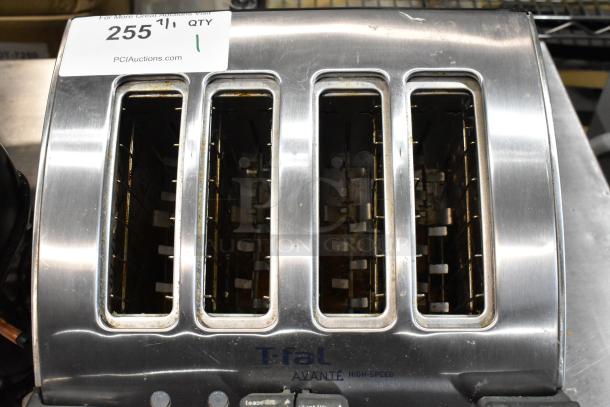 T-fal Avante four-slice toaster, stainless steel, well-used condition, some wear and marks, auction tag number 255 visible.