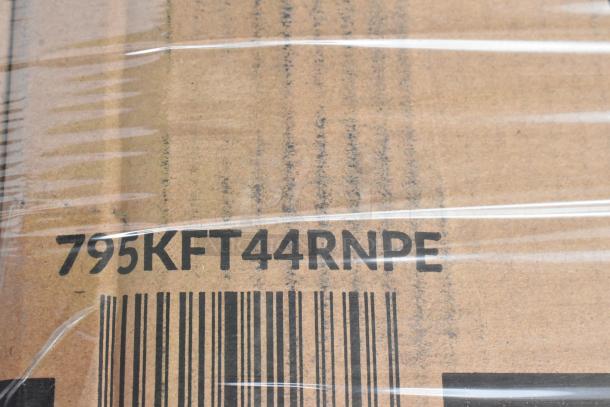 Cardboard box with barcode and markings "795KFT44RNPE," wrapped in clear plastic.