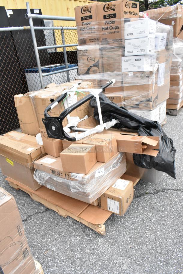 Pallet of assorted cardboard boxes and a metal frame, some labeled "Choice" and "Paper Hot Cups," in used condition.