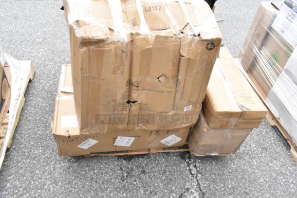 Damaged cardboard boxes on a pallet, some with visible holes and tape. Labels with numbers and codes are affixed.