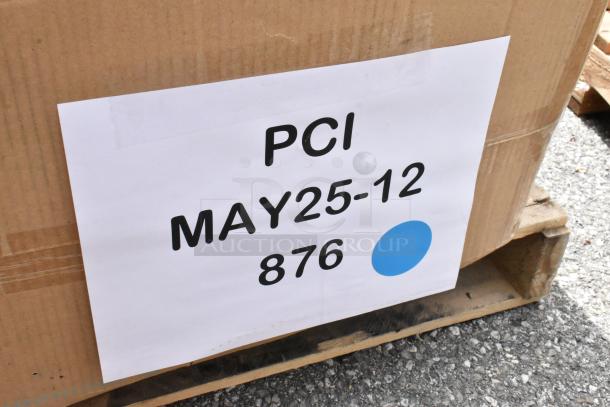 Cardboard box with label "PCI MAY25-12 876" and a blue dot, on a wooden pallet. Condition: Sealed.