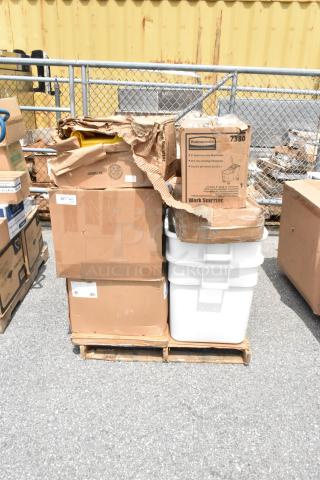Pallet with assorted cardboard boxes, including Rubbermaid mop bucket box, condition appears mixed; labels visible.