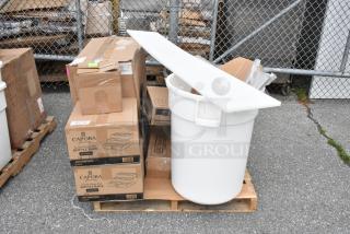 Pallet with Capora bottle rack boxes and a large white plastic bin. Items appear in good condition.