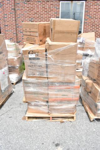 Pallet of boxed items, including Choice brand hot cups, wrapped in plastic. Boxes show "Handle with Care" label. Slight wear visible.
