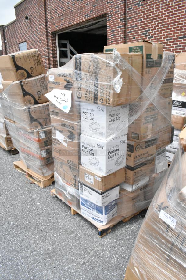 Pallet of assorted food service items, including portion cup lids and foil bags, wrapped in plastic, on sale at auction.