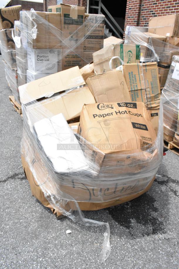 Pallet of cardboard boxes wrapped in plastic, containing various disposable food containers and cups. Boxes labeled "Choice Paper Hot Cups."