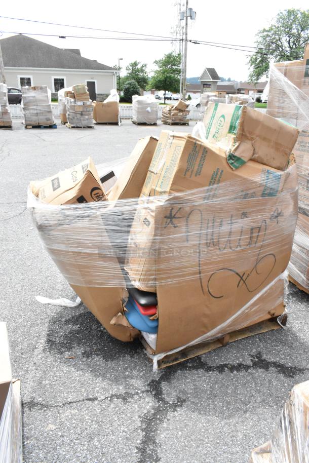 Large pallet of assorted cardboard boxes, wrapped in plastic. Markings indicate "Pallet," shows signs of wear.